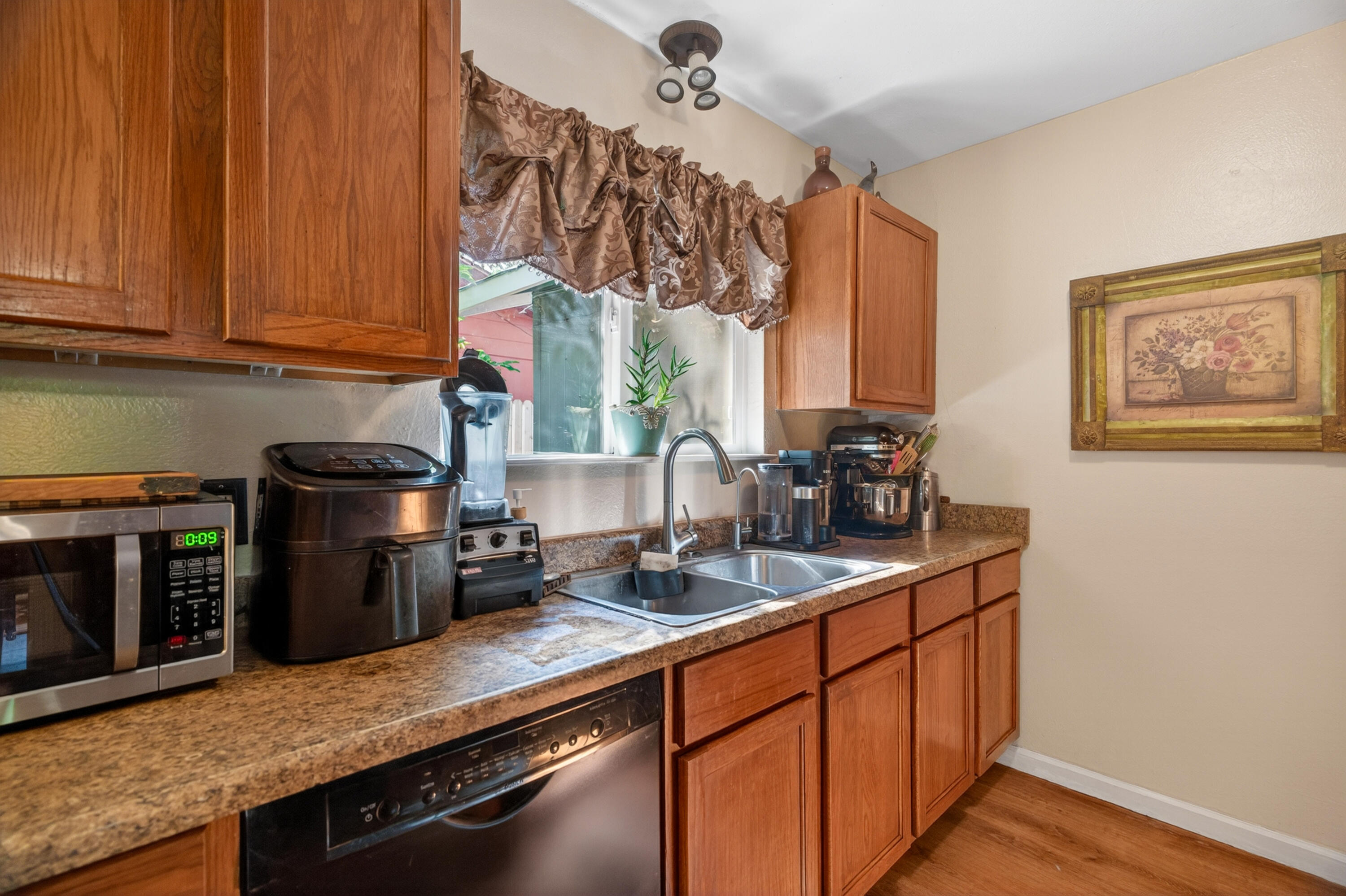 1391 Rouge Road Shasta Lake, CA 96019 - Photo 12 of 30 a kitchen with stainless steel appliances granite countertop a sink stove and microwave