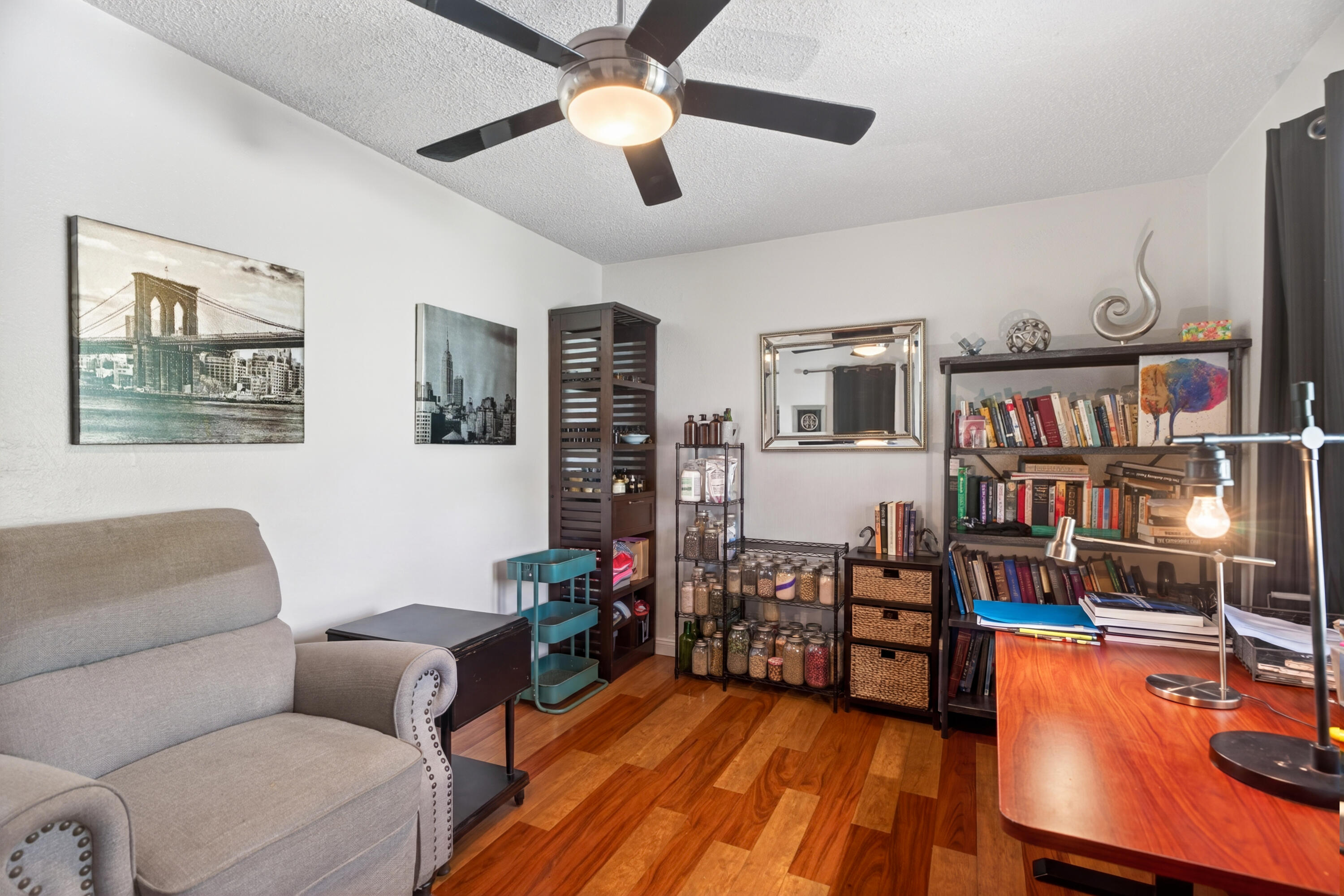 1391 Rouge Road Shasta Lake, CA 96019 - Photo 21 of 30 a living room with furniture a flat screen tv and a book shelf