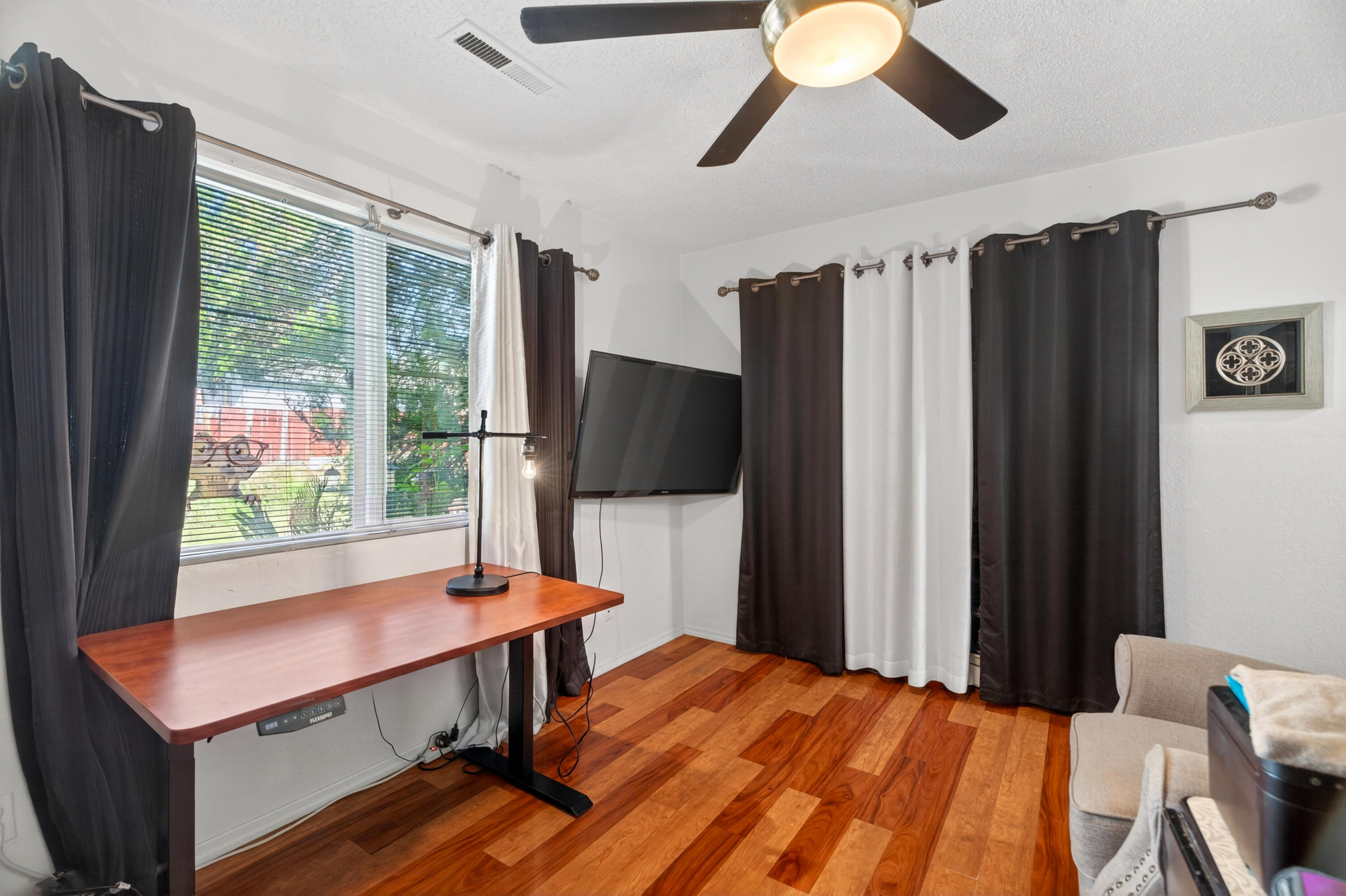 1391 Rouge Road Shasta Lake, CA 96019 - Photo 22 of 30 a bedroom with a bed and a flat screen tv