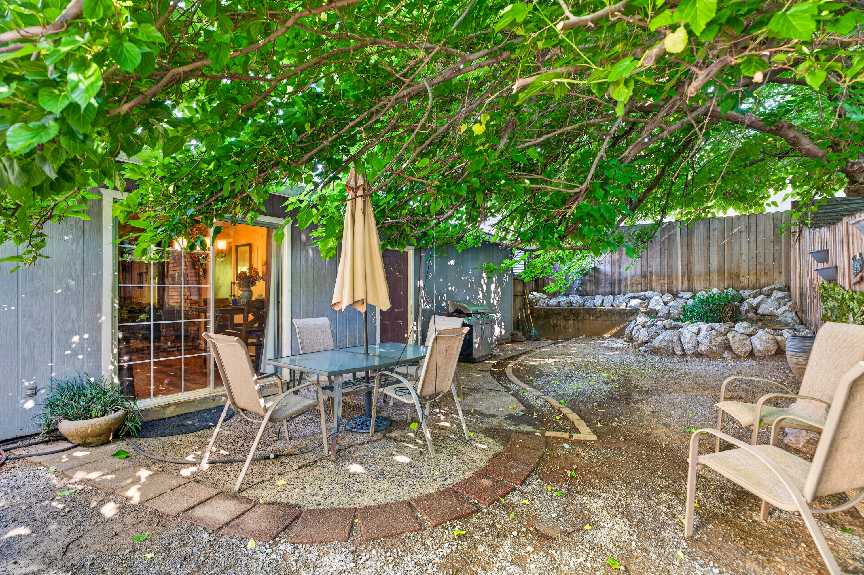 1391 Rouge Road Shasta Lake, CA 96019 - Photo 26 of 30 a view of a backyard with sitting area