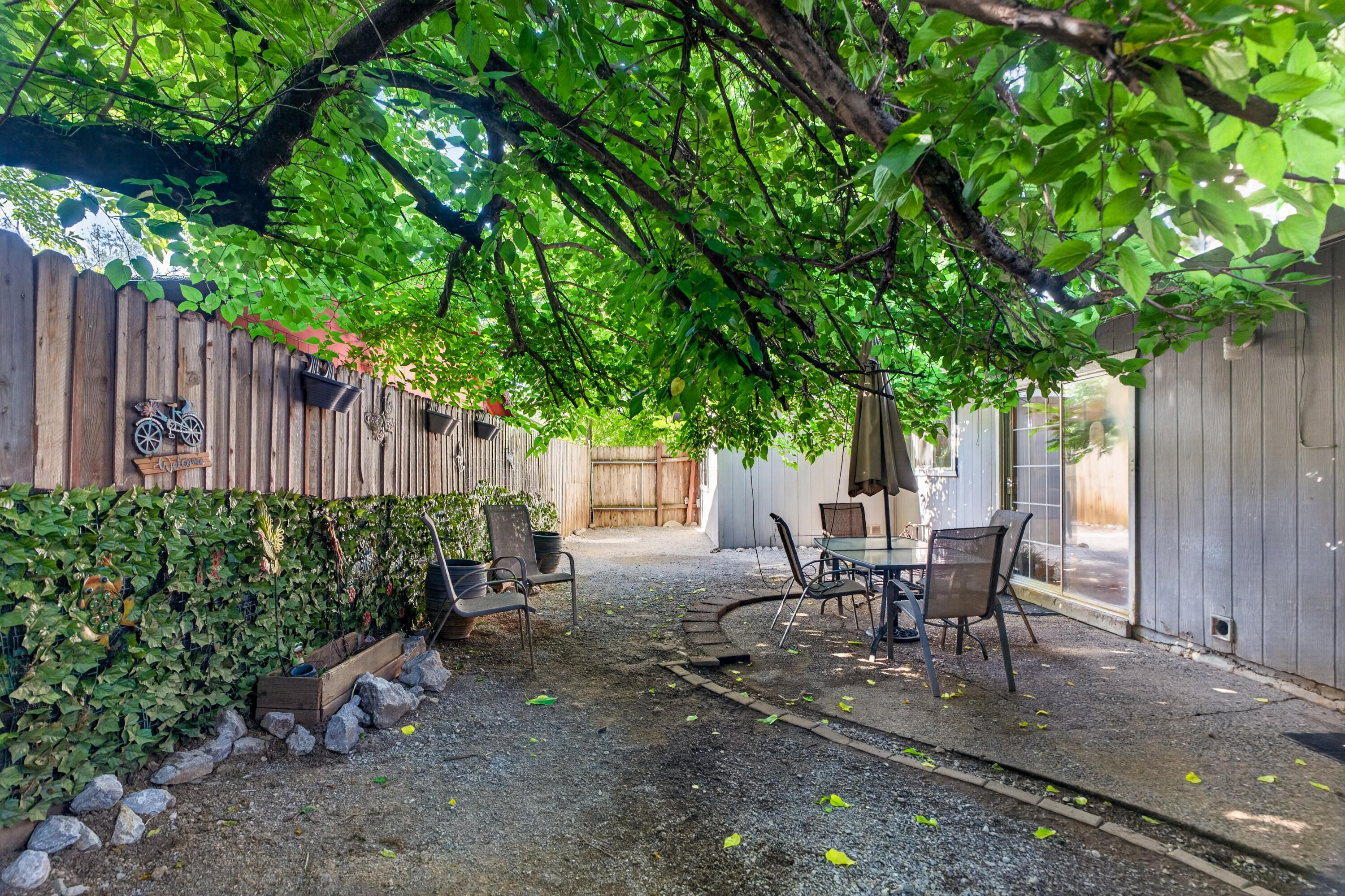 1391 Rouge Road Shasta Lake, CA 96019 - Photo 28 of 30 a view of a backyard with sitting area