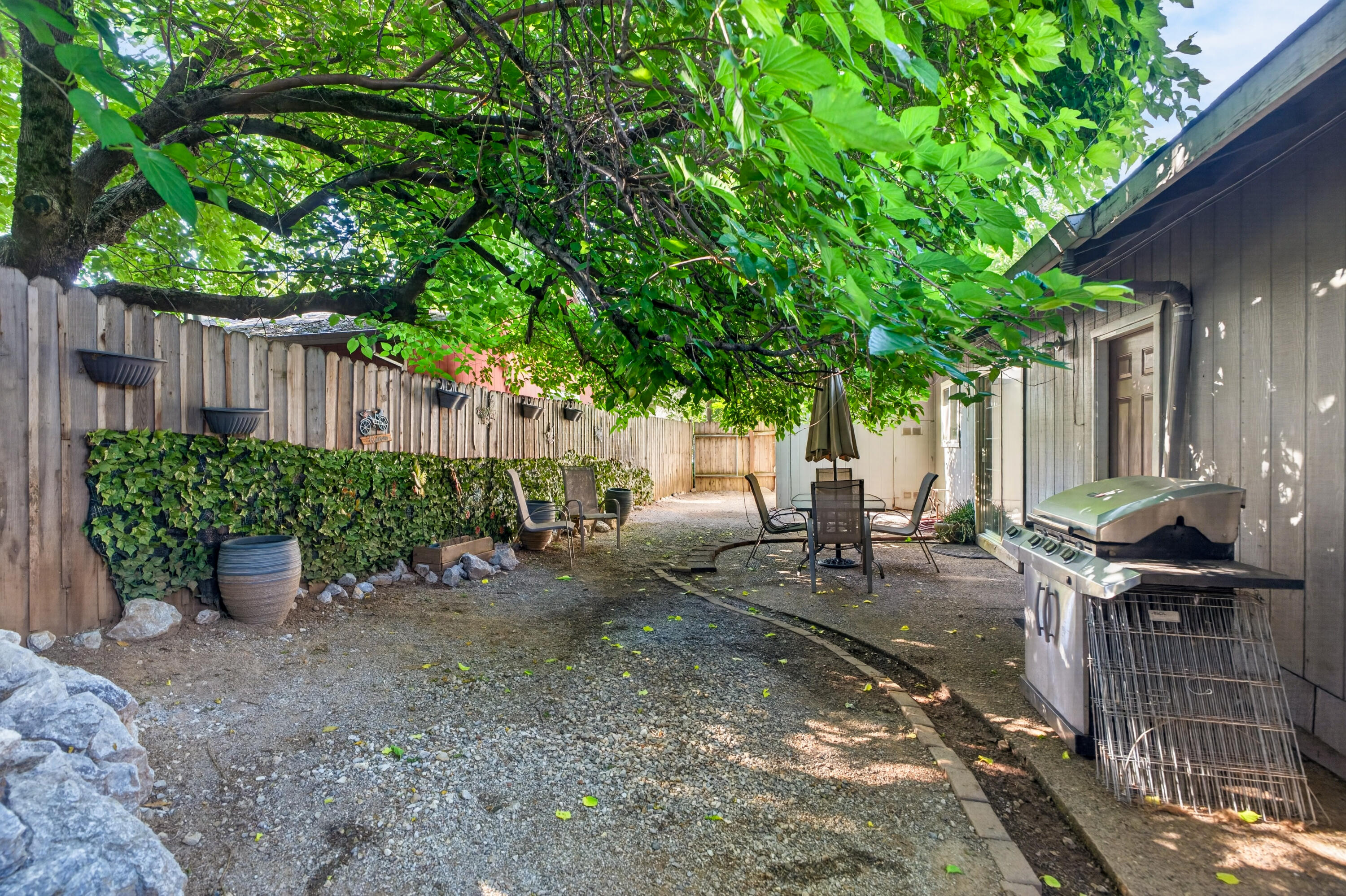 1391 Rouge Road Shasta Lake, CA 96019 - Photo 29 of 30 a view of a backyard with sitting area and furniture