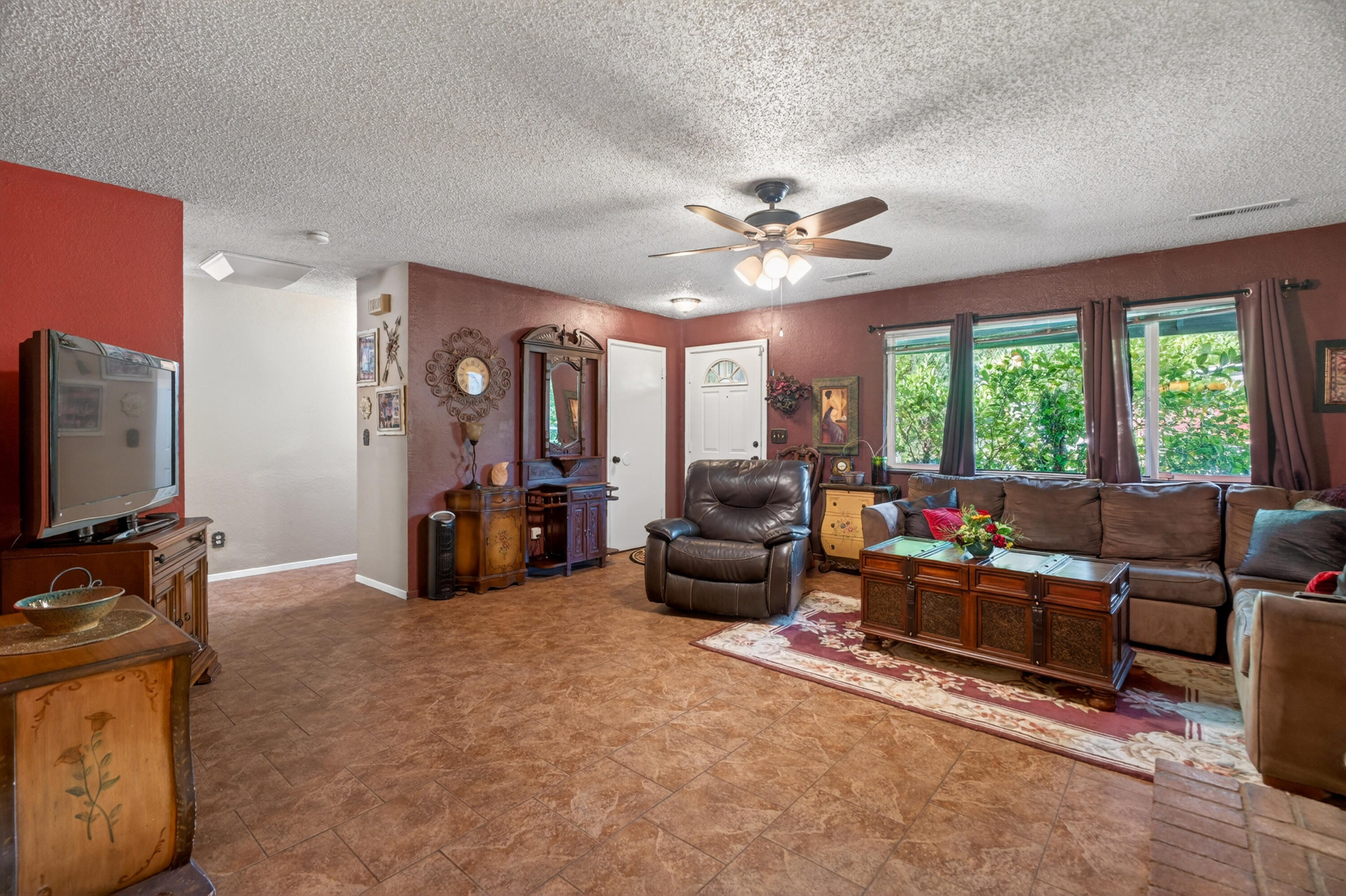1391 Rouge Road Shasta Lake, CA 96019 - Photo 9 of 30 a living room with furniture and a flat screen tv