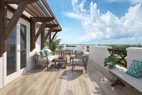 a view of a balcony with chairs and wooden floor