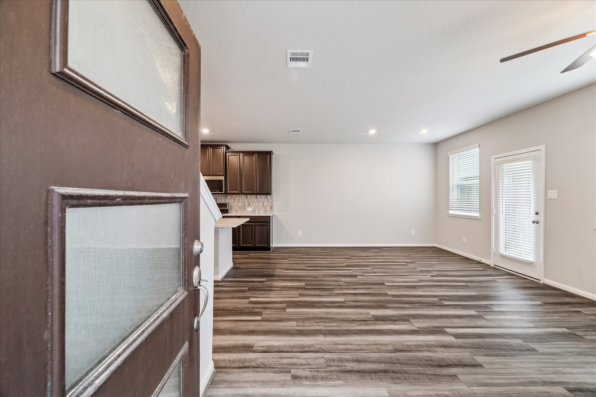 5502 Cuerta Street Houston, TX 77023 - Photo 4 of 25 Immediately enter into the spacious family room with high ceilings and natural light.