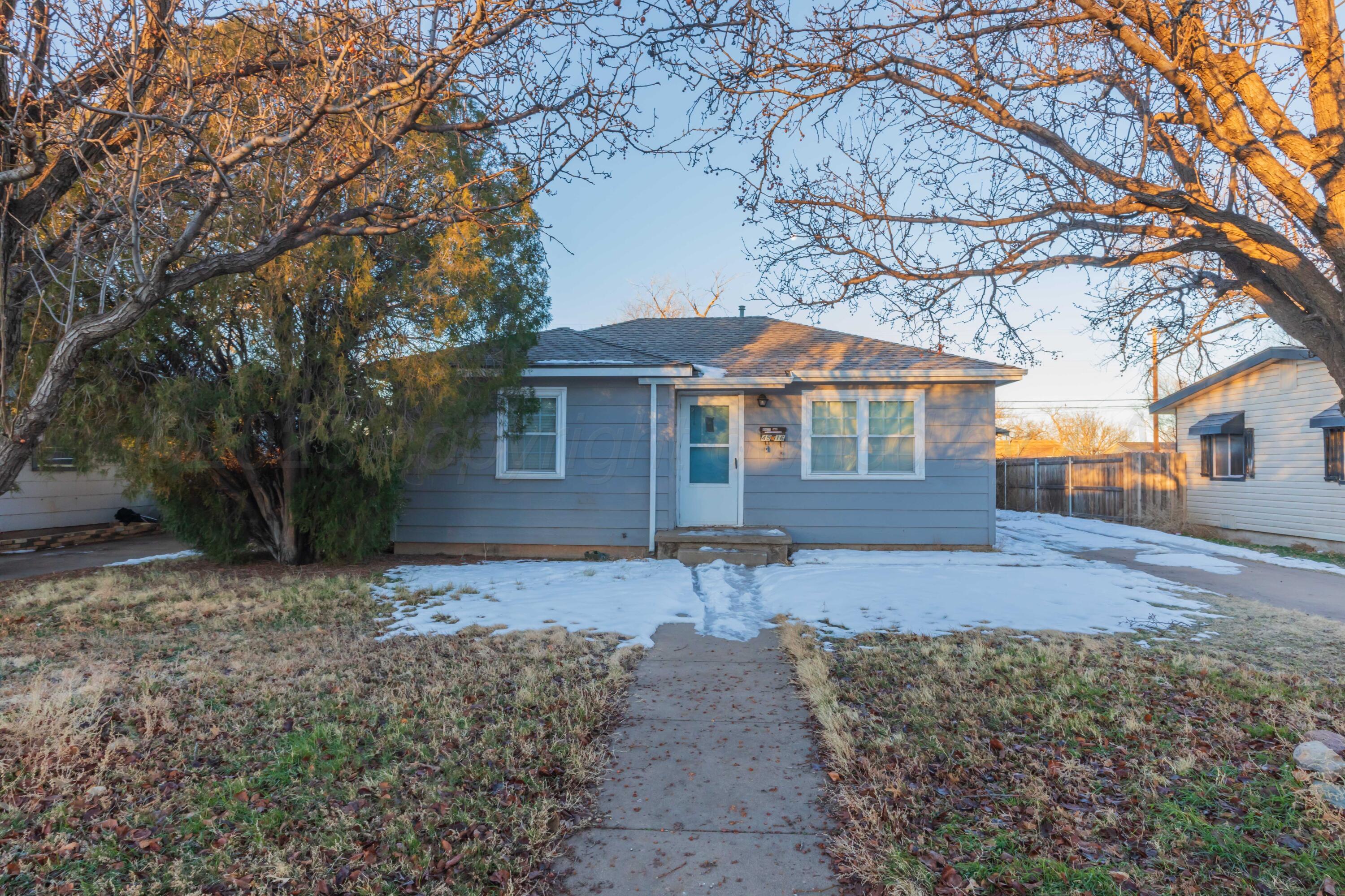 4516 South Bonham Street Amarillo, TX 79110 - Photo 1 of 30 a front view of a house with a yard