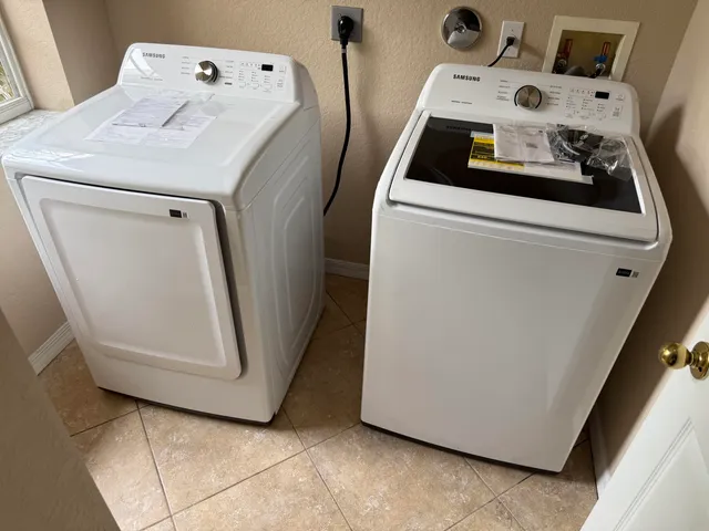 a utility room with dryer and washer