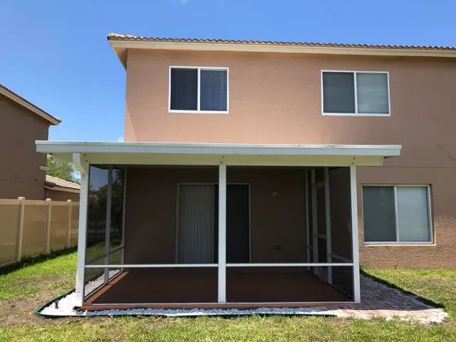 a view of backyard with door