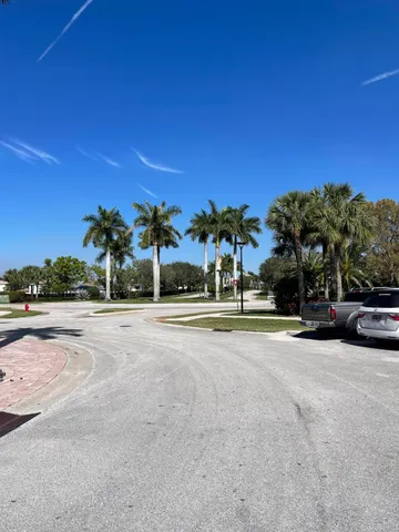 a view of a street with a building in the background