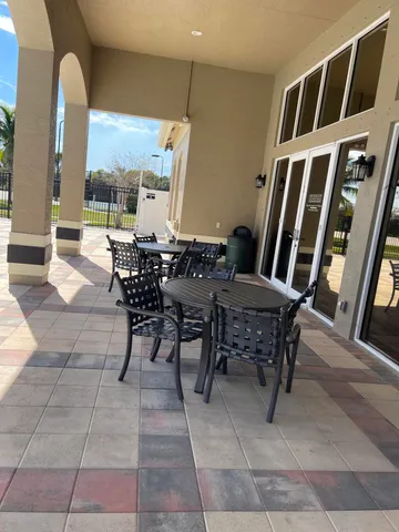 a view of an outdoor dining space with furniture