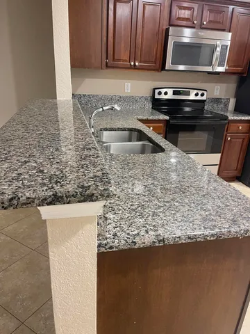 a kitchen with a stove and a microwave