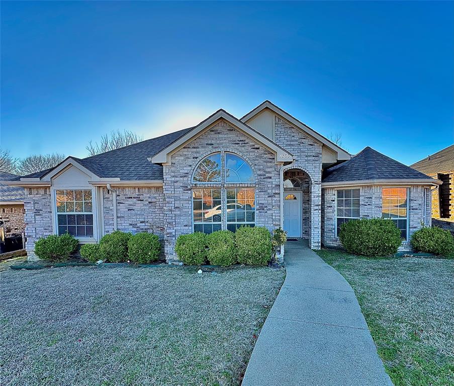 1265 Cedarcrest Drive Mesquite, TX 75149 - Photo 1 of 1 a front view of a house with a yard