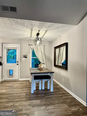a living room with fireplace furniture and a window