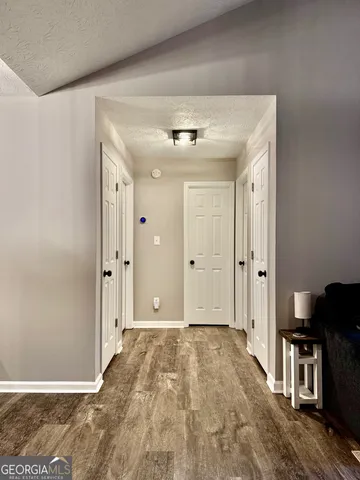 a view of a hallway with a bedroom