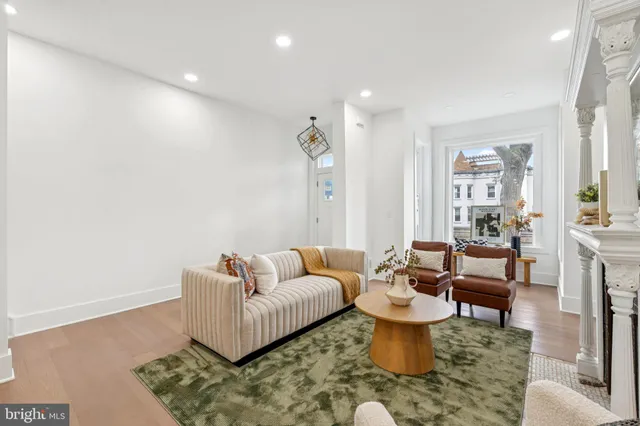 a living room with furniture and a rug