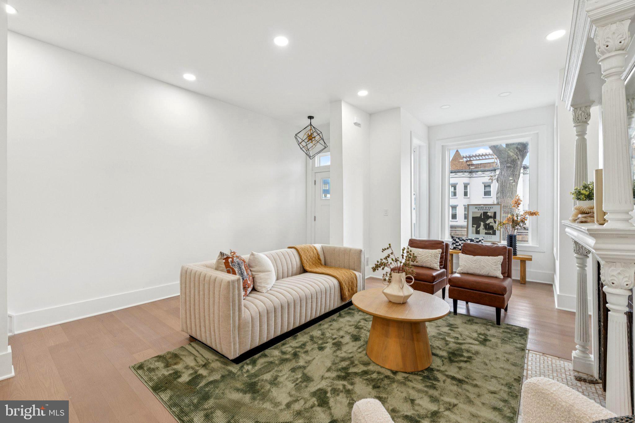 a living room with furniture and a rug