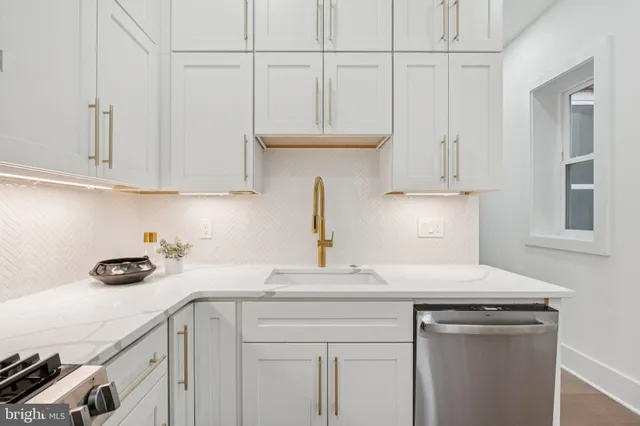 a kitchen with a sink and cabinets