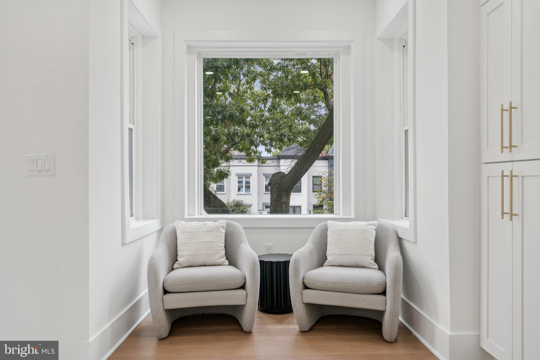 1827 North Capitol Street Northeast Washington, DC 20002 - Photo 20 of 53 a living room with furniture and a large window