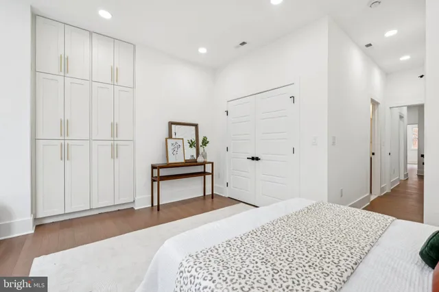 a bedroom with a bed and a table