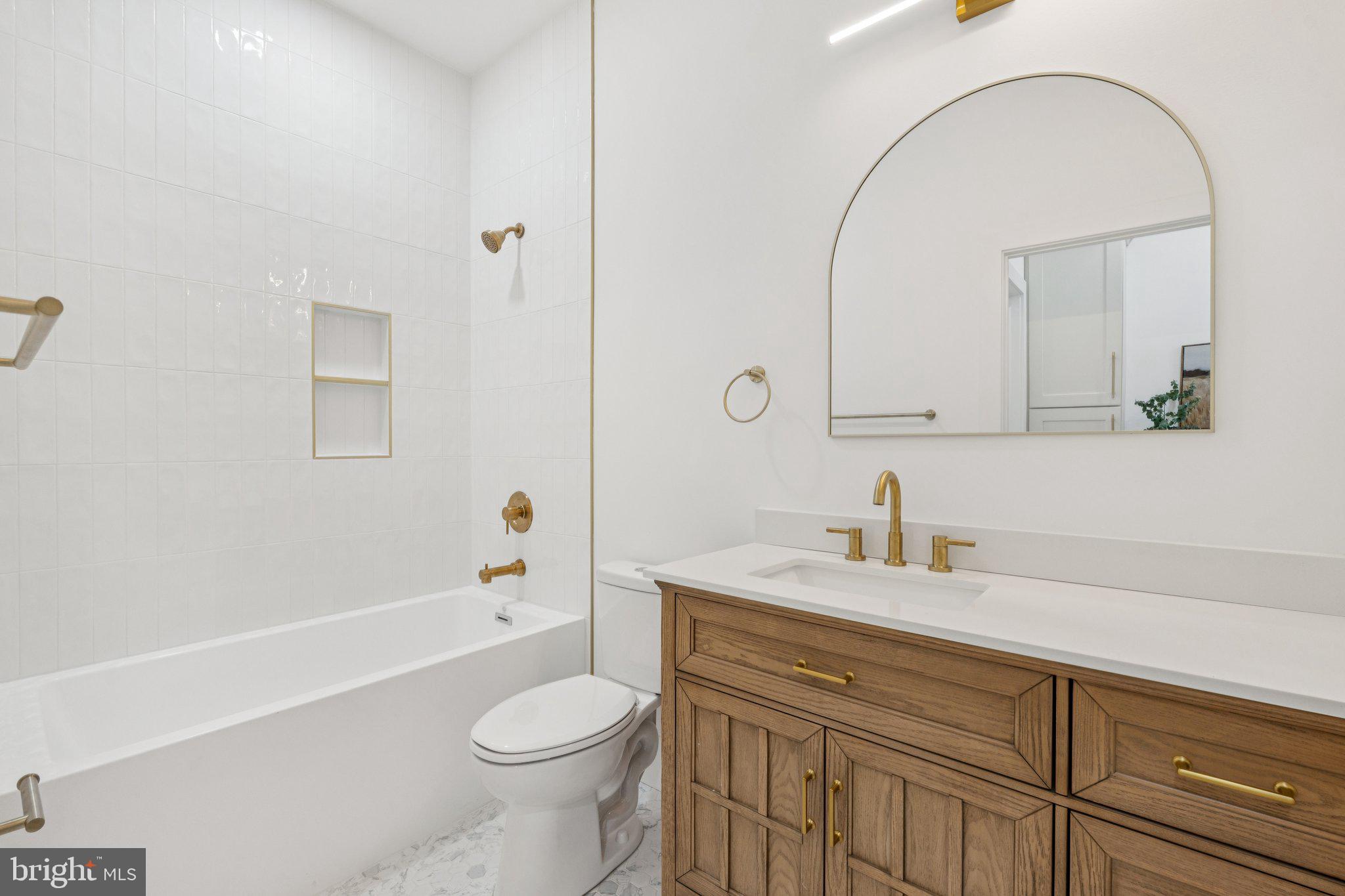 1827 North Capitol Street Northeast Washington, DC 20002 - Photo 29 of 53 a bathroom with a sink a toilet and a mirror