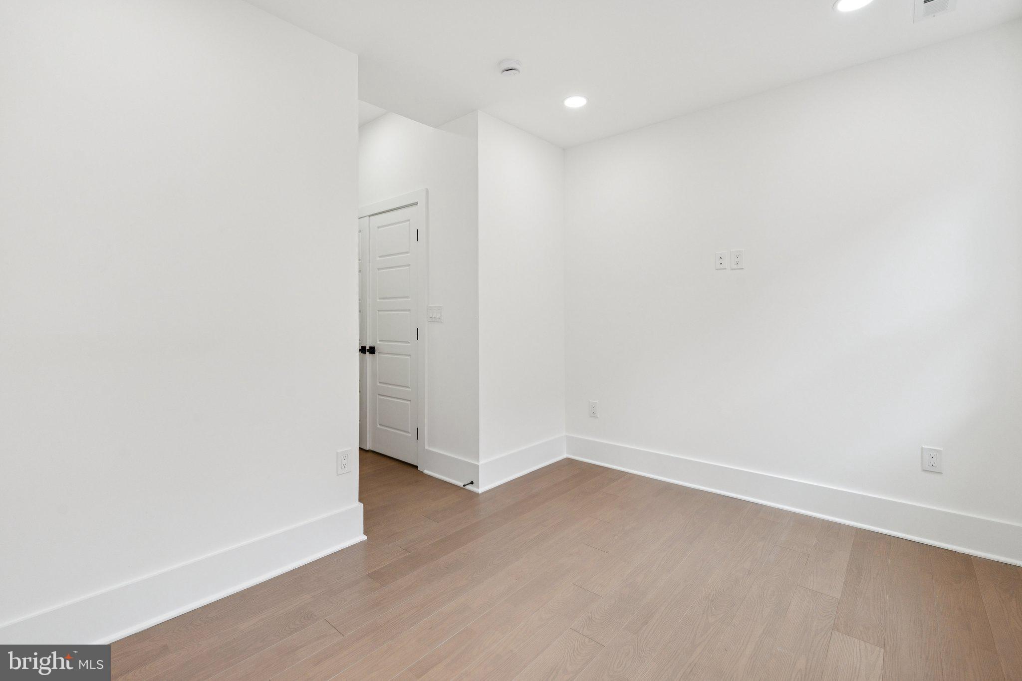 1827 North Capitol Street Northeast Washington, DC 20002 - Photo 32 of 53 an empty room with wooden floor