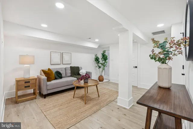 a living room with furniture and a table