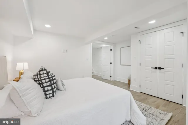 a bedroom with a bed and a couch