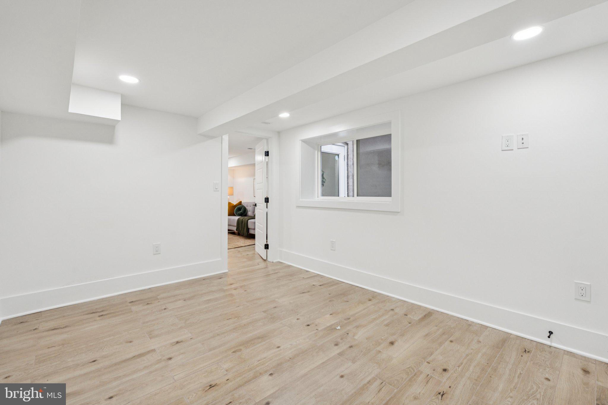 1827 North Capitol Street Northeast Washington, DC 20002 - Photo 44 of 53 wooden floor in an empty room with a window