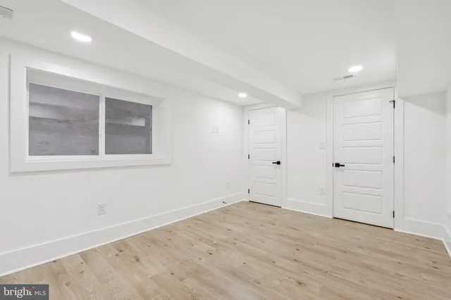 a front view of a house with a large window and table