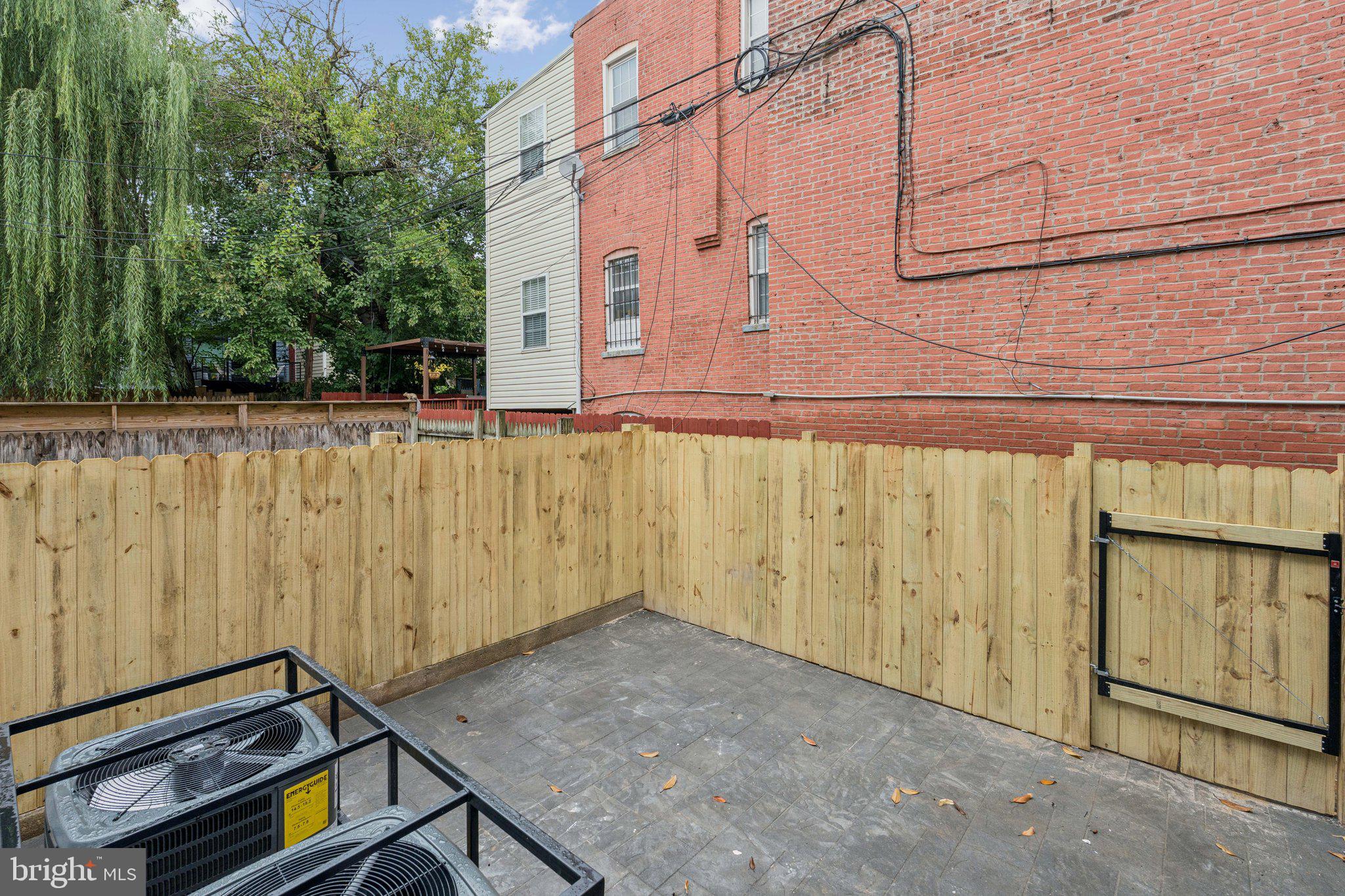 1827 North Capitol Street Northeast Washington, DC 20002 - Photo 49 of 53 a view of a backyard with a wooden fence