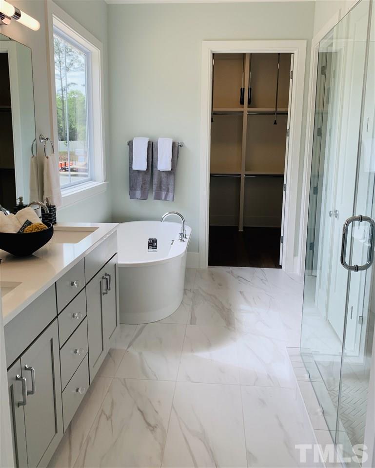 3036 Eden Harbor Court Raleigh, NC 27613 - Photo 10 of 22 With Double Sinks, Shower,Linen closet & separate WC