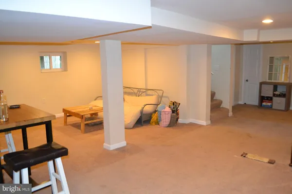 a view of living room with furniture and a window