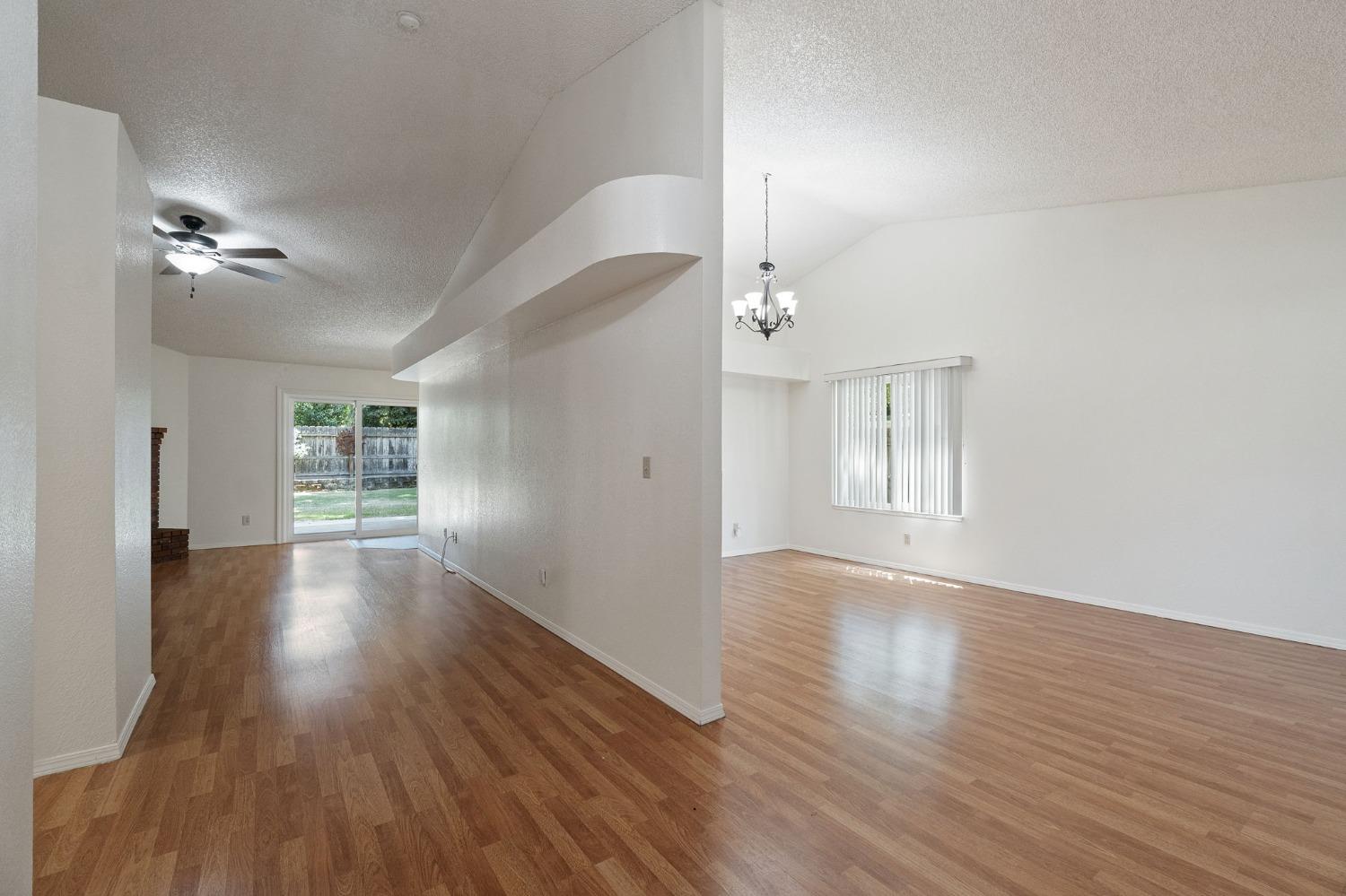 2500 Mitchell Avenue Clovis, CA 93611 - Photo 13 of 31 a view of an empty room with wooden floor and a window