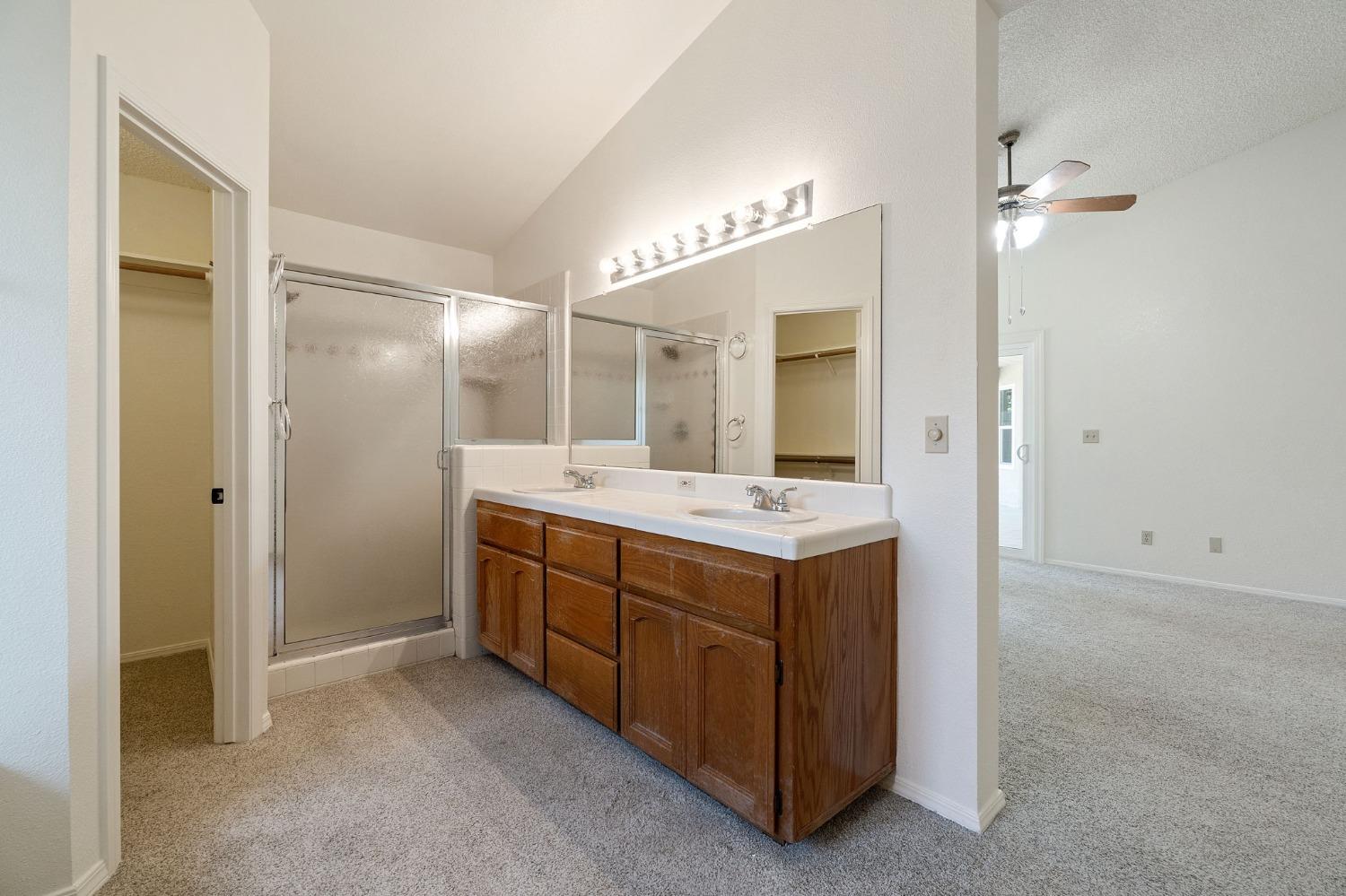 2500 Mitchell Avenue Clovis, CA 93611 - Photo 23 of 31 a bathroom with a double vanity sink and a mirror