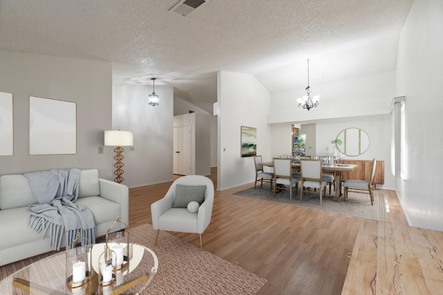 2500 Mitchell Avenue Clovis, CA 93611 - Photo 3 of 31 a living room with furniture and a dining table with wooden floor