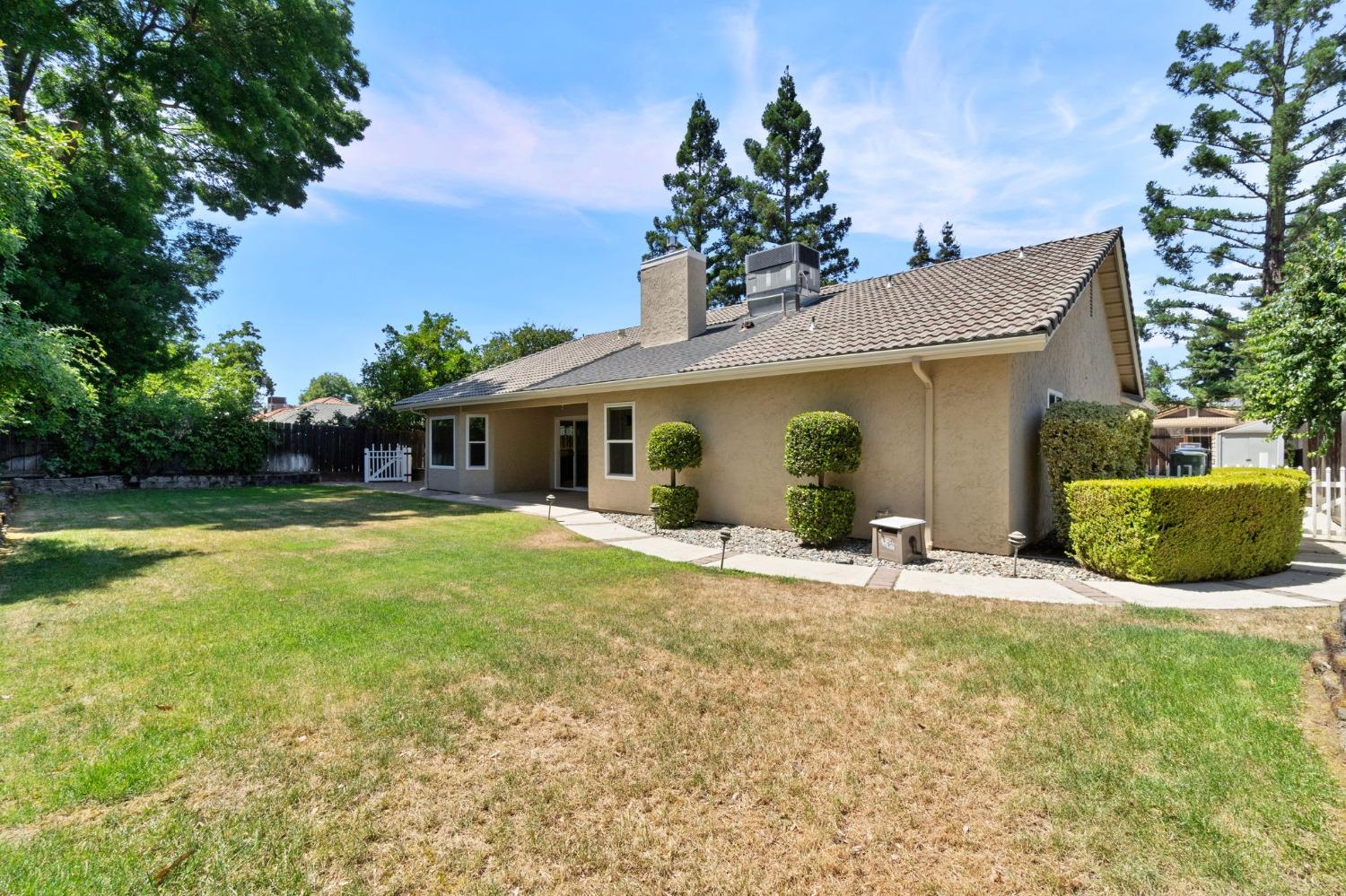 2500 Mitchell Avenue Clovis, CA 93611 - Photo 10 of 31 a view of a house with backyard and sitting area