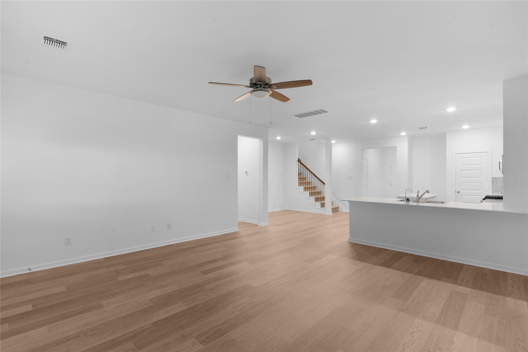 25612 Wheat Seed Lane Elgin, TX 78621 - Photo 16 of 26 an empty room with wooden floor and windows