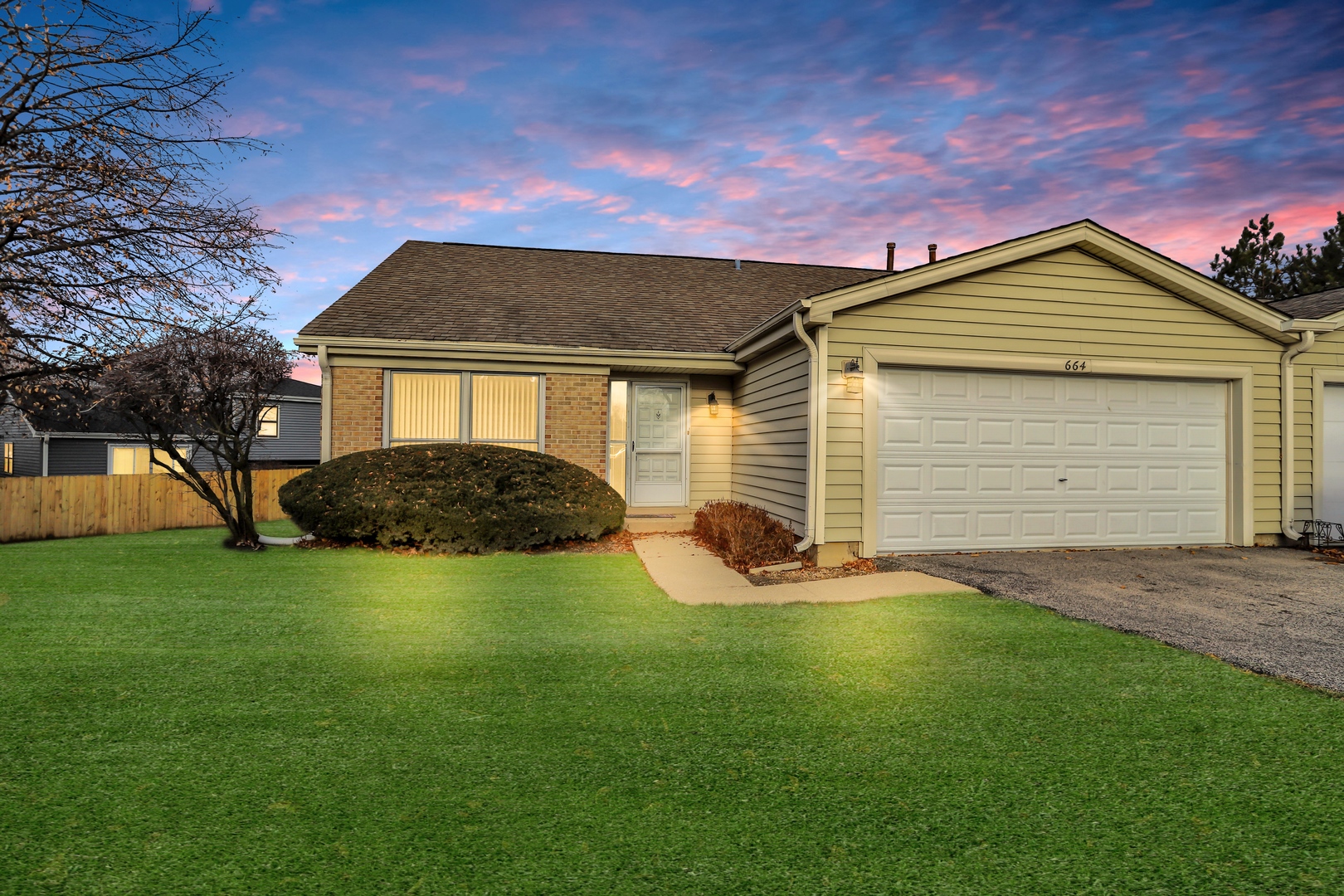 664 Claridge Circle Hoffman Estates, IL 60169 - Photo 1 of 35 a front view of a house with a yard and garage