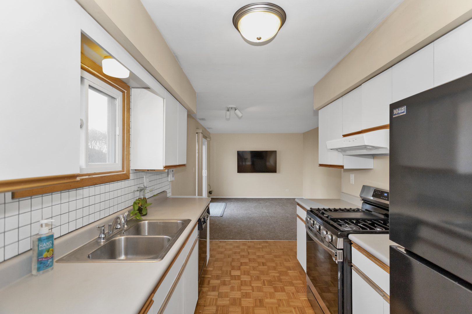 664 Claridge Circle Hoffman Estates, IL 60169 - Photo 13 of 35 a kitchen with stainless steel appliances granite countertop a sink stove and refrigerator
