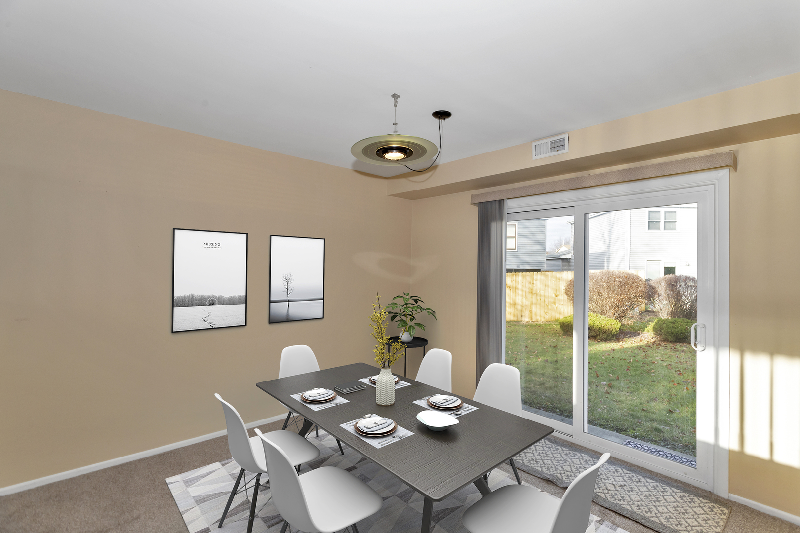 664 Claridge Circle Hoffman Estates, IL 60169 - Photo 6 of 35 a view of a dining room with furniture a potted plant and wooden floor