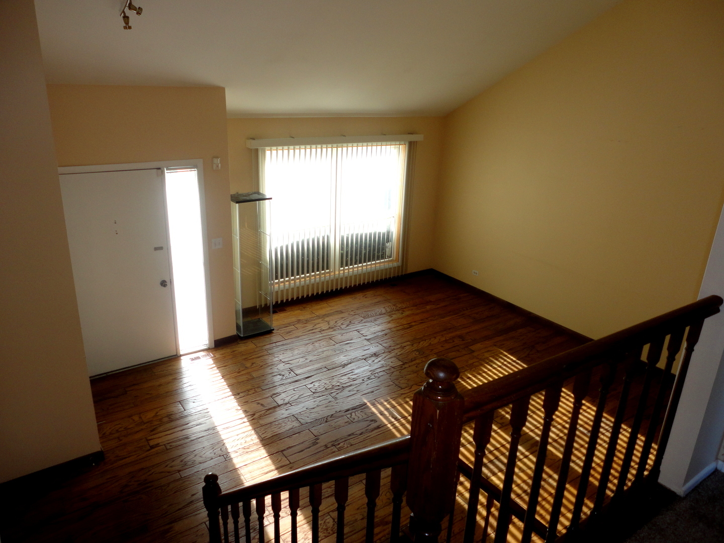 664 Claridge Circle Hoffman Estates, IL 60169 - Photo 10 of 35 a view of an empty room and wooden floor