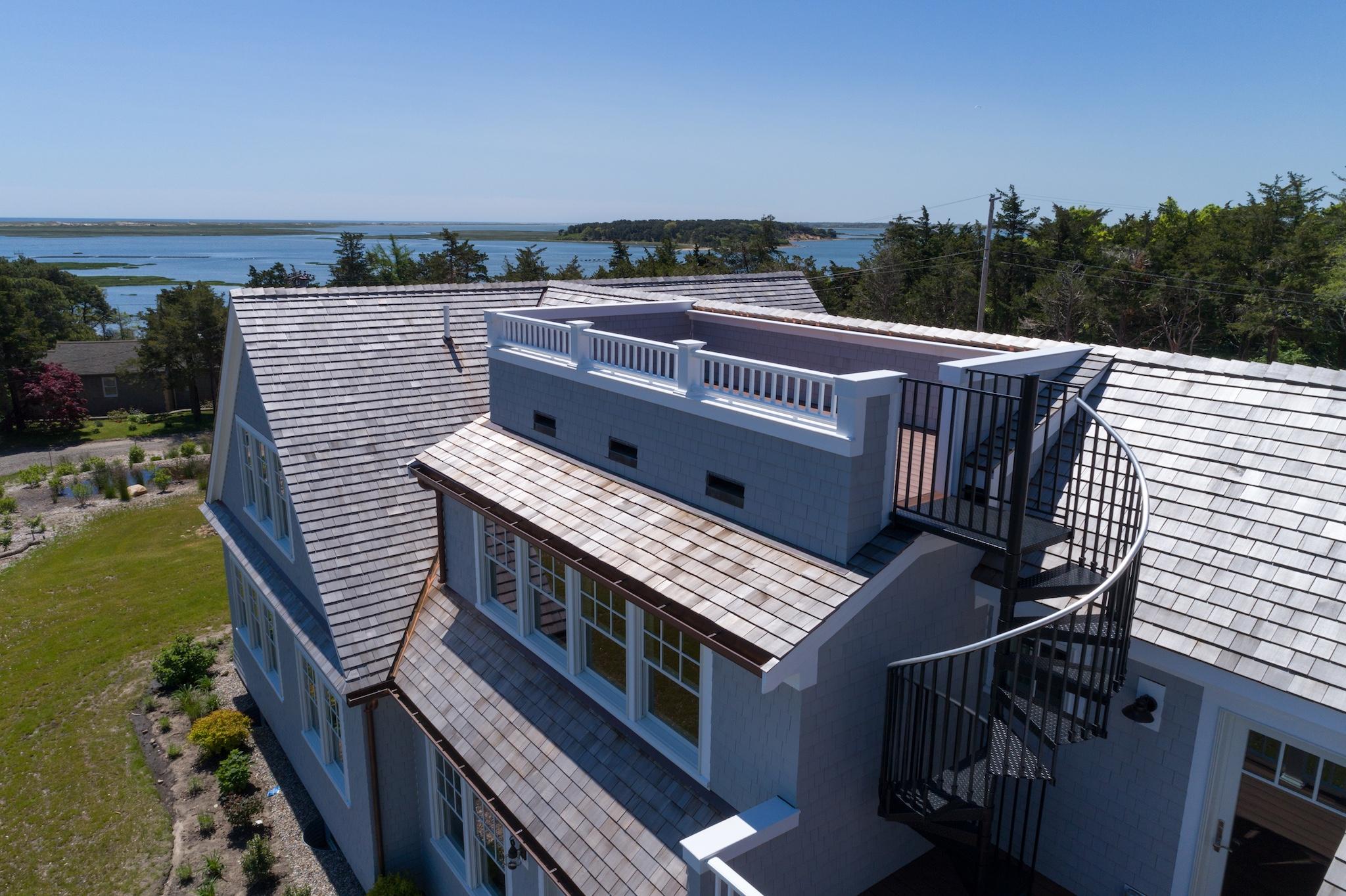 43 Payson Lane Orleans, MA 02653 - Photo 15 of 34 a view of a balcony with wooden floor and outdoor space