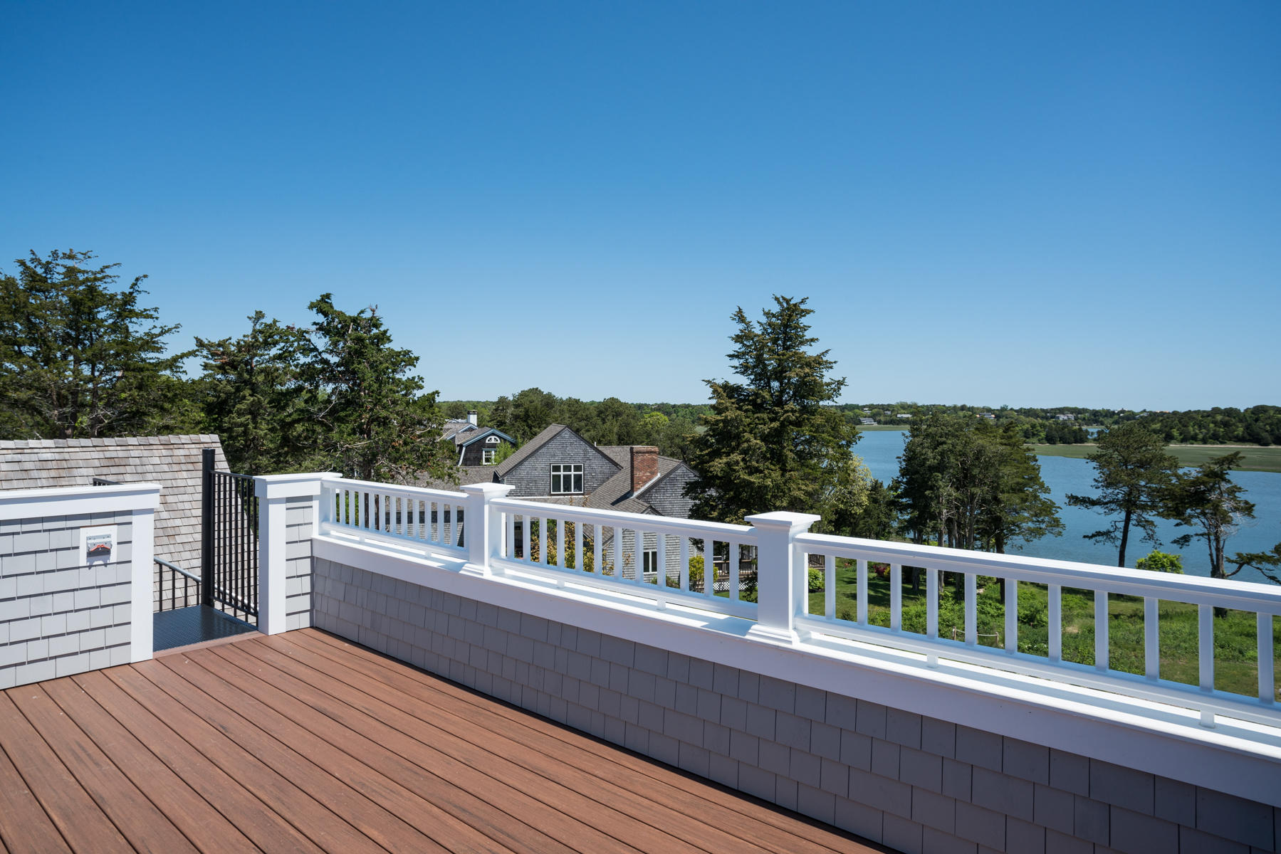 43 Payson Lane Orleans, MA 02653 - Photo 17 of 34 a view of a balcony with wooden floor and fence
