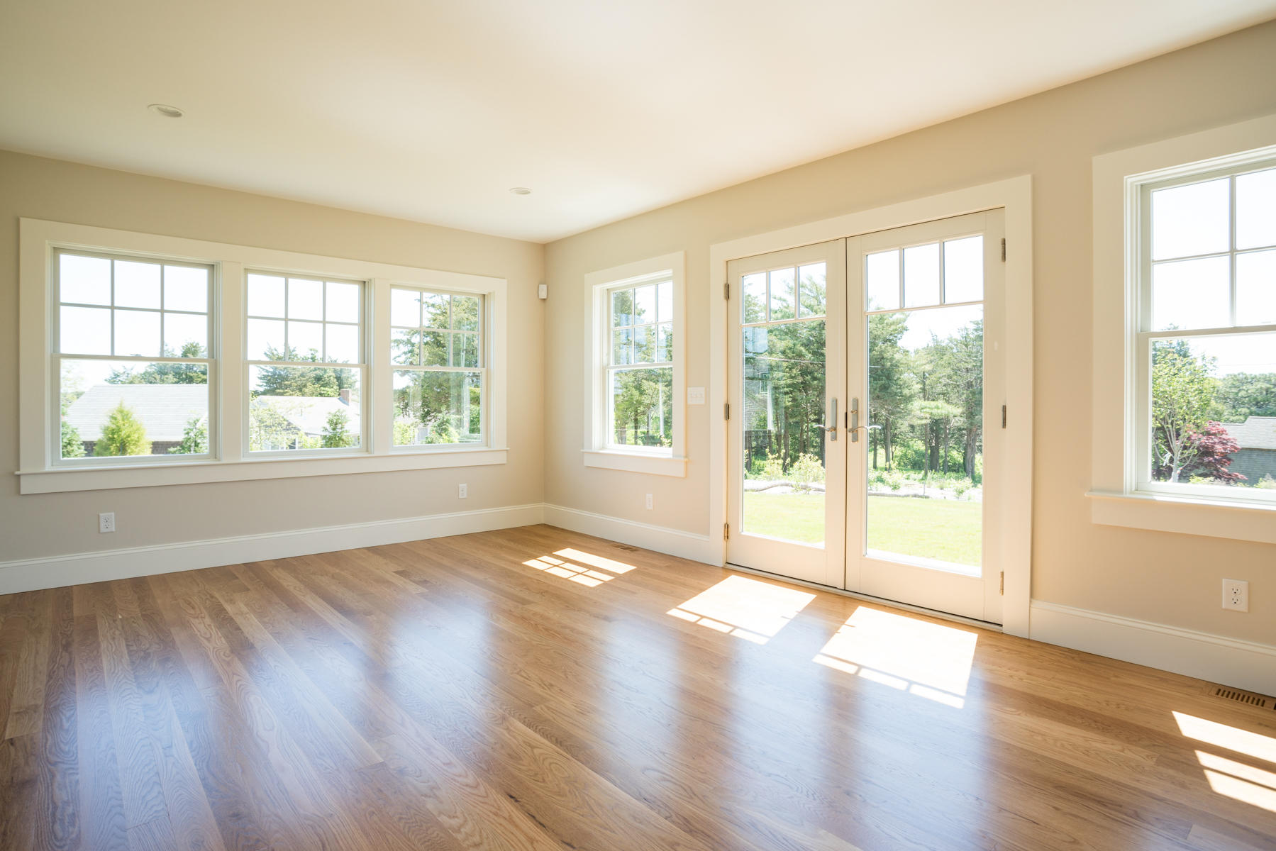 43 Payson Lane Orleans, MA 02653 - Photo 23 of 34 a view of an empty room with wooden floor and a window