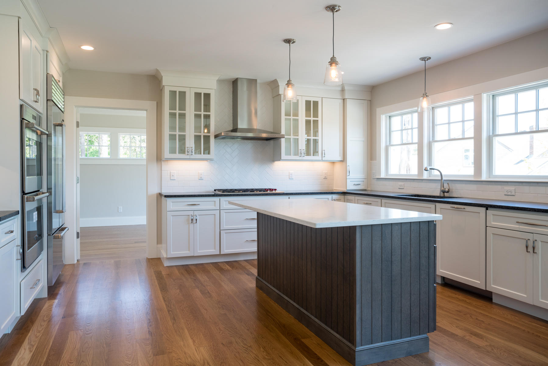 43 Payson Lane Orleans, MA 02653 - Photo 5 of 34 a kitchen with granite countertop a sink cabinets and wooden floor