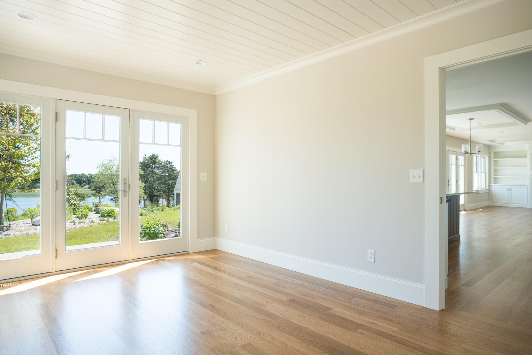 43 Payson Lane Orleans, MA 02653 - Photo 6 of 34 an empty room with wooden floor and windows