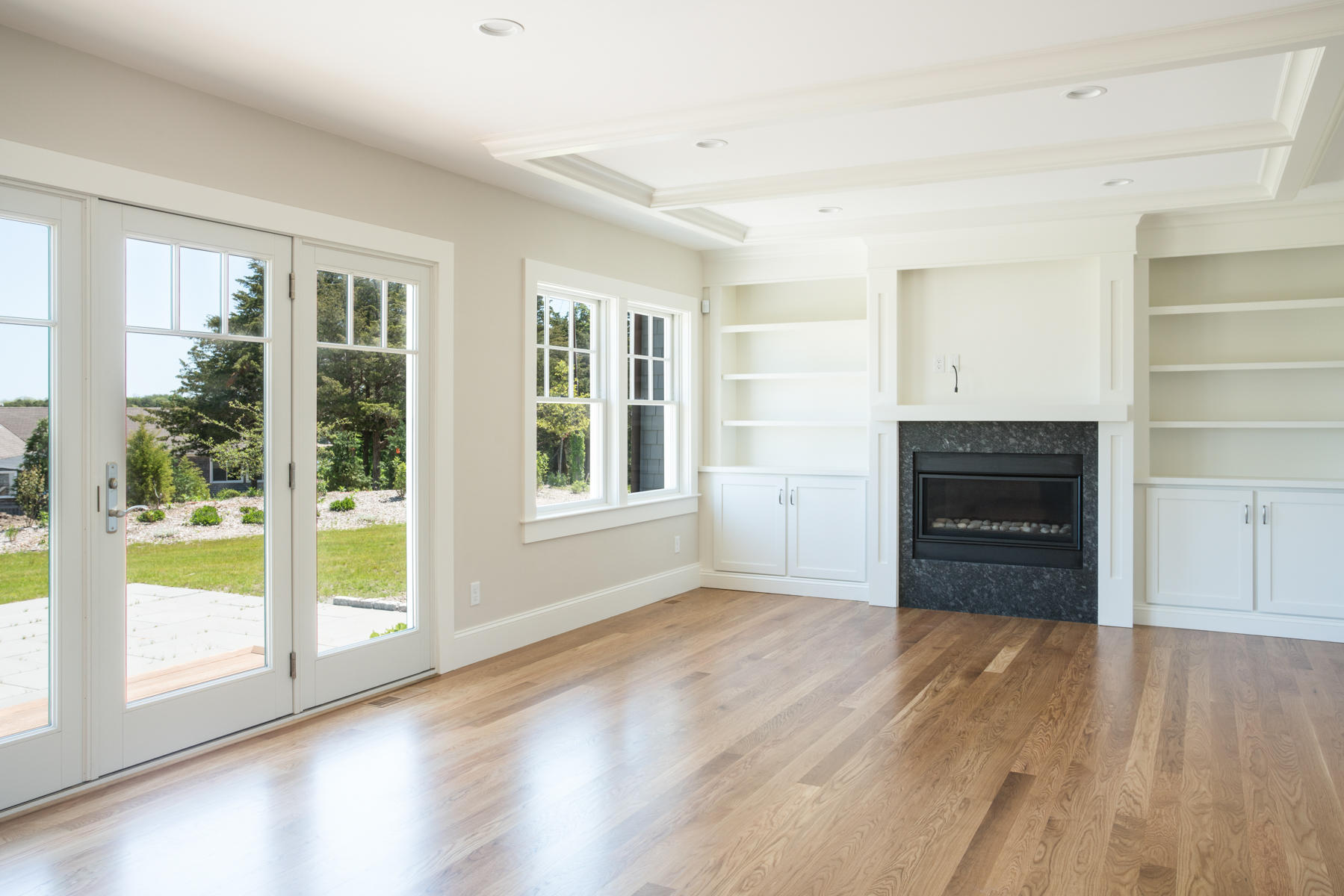 43 Payson Lane Orleans, MA 02653 - Photo 10 of 34 a view of an empty room with a window and wooden floor