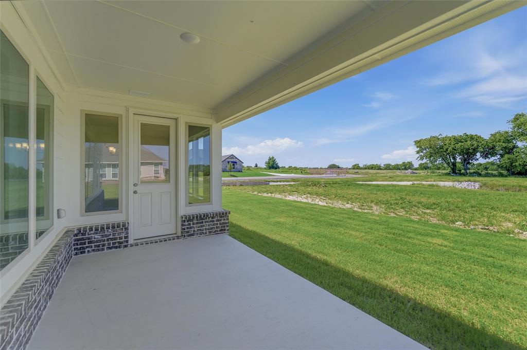 130 Fossil Canyon Drive Rhome, TX 76078 - Photo 21 of 25 Covered patio with a concrete surface