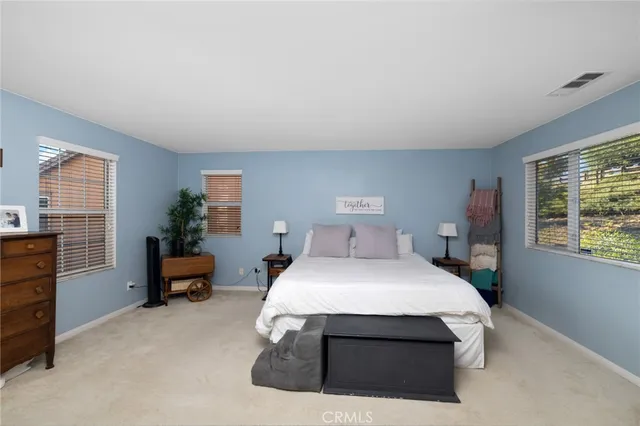 a bedroom with a bed and furniture