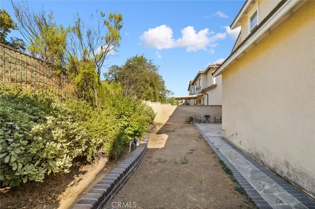 a view of a yard with flower plants